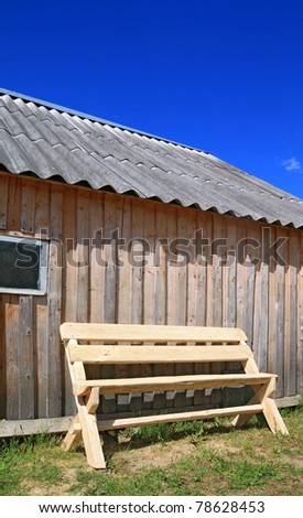 wooden bench near wooden wall