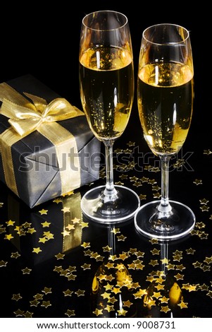 Elegant gift box and two champagne flutes for  celebration special event