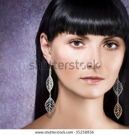 Woman with silver earrings