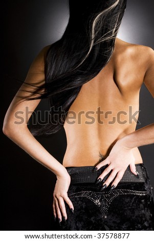 Gorgeous woman with long black hair. On trousers this is not logo.