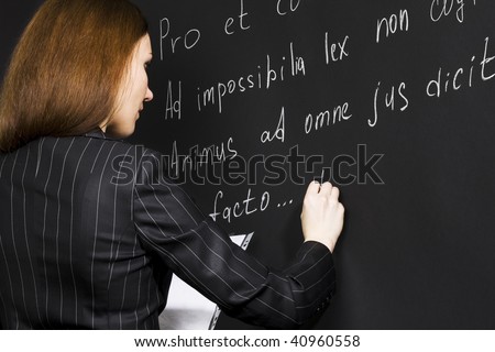 Young teacher writing legal proverbs in latin language