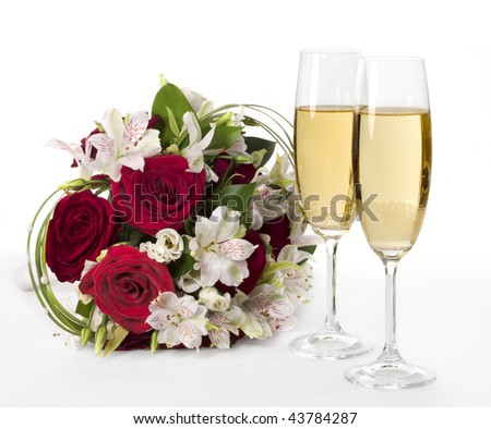 stock photo Two champagne flutes with wedding bouquet