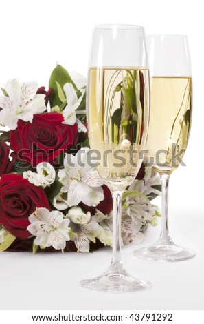 stock photo Two champagne flutes with wedding bouquet