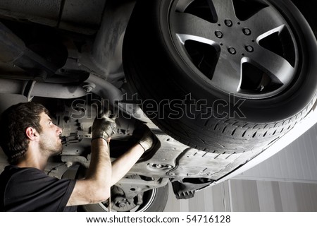 Auto mechanic working at auto repair shop