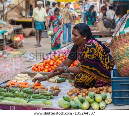 CHENNAI, INDIA - FEBRUARY 10: An unidentified  the woman sells vegetables on February 10, 2013 in Chennai, India. Fresh vegetables is traditional food  of Hinduism\'s adherents.