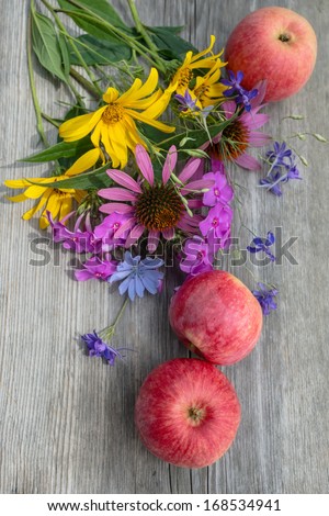still life with flowers and apples