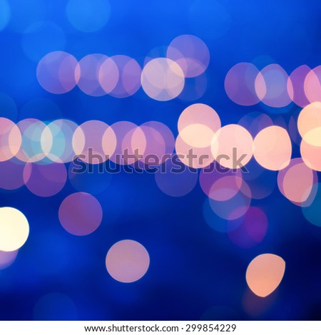 beautiful big city blurring lights abstract circular bokeh blue background, closeup