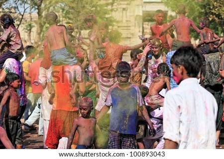 HAMPI, INDIA - MARCH 9: Unidentified people celebrate Holi festival in Hampi, India, March 9, 2012. It is a religious spring holiday and also known as Festival of Colours.