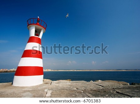 Crazy lighthouse. White and red lighthouse in Peniche, Portugal.