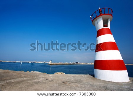 Crazy lighthouse. White and red lighthouse in Peniche, Portugal.