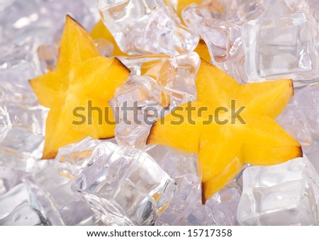 Ice Stars. Closeup view of the carambola with ice cubes