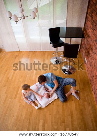 Best daddy. Father babysitting 4 years old son and newborn daughter