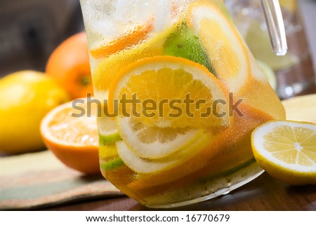 Lemon, orange and carafe with citrus ice water