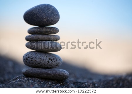 Balanced Stones. Stack of volcanic pebbles on seashore