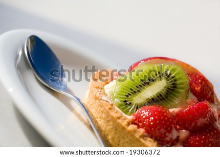 Fresh Fruit Tart. Closeup of delicious dessert with fresh fruits and berries
