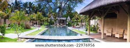 Panorama of beautiful wellness area and swimming pool in luxury resort.