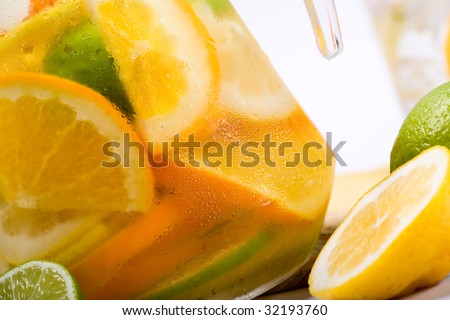 Summer drink. Orange and carafe with citrus ice water