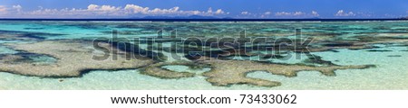Panoramic photo of turquoise tropical ocean waters