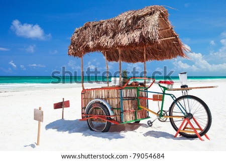 Exotic beach bar transformed from bike at Caribbean beach in Mexico