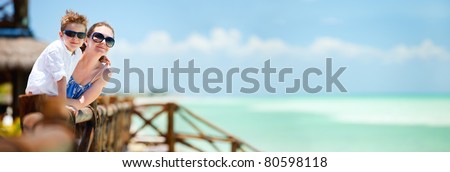 Panoramic photo of mother and son portrait on tropical vacation