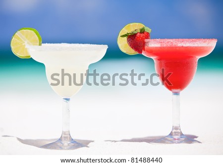 Classic and strawberry margarita cocktails at exotic Mexican beach