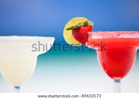 Classic and strawberry margarita cocktails at Mexican beach
