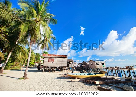 Sea gypsy village at Kalapuan island near Borneo in Malaysia Sea gypsy village at Kalapuan island near Borneo in Malaysia