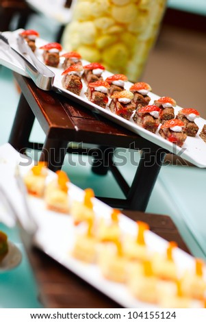 Many delicious desserts at restaurant buffet table