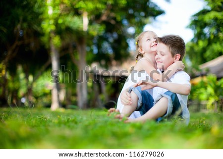 Adorable happy kids outdoors on summer day