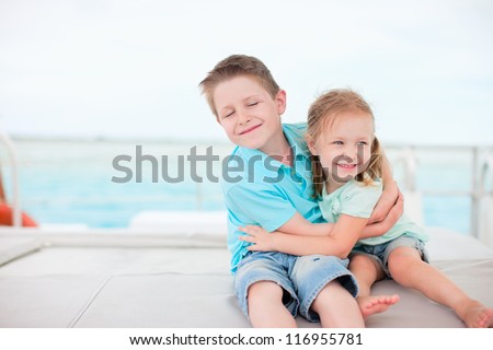 Happy brother and sister embracing each other