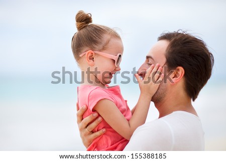Happy father and his adorable little daughter outdoors