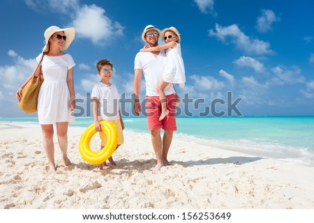 Happy Beautiful Family On A Tropical Beach Vacation