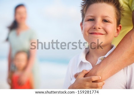 Cute boy and his family on vacation