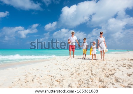 Happy beautiful family on a Caribbean holiday vacation