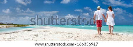 Panorama of a romantic couple at Caribbean beach