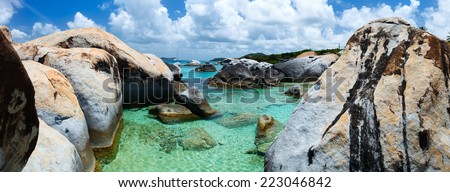 Panorama of The Baths beach area major tourist attraction at Virgin Gorda, British Virgin Islands with turquoise water and huge granite boulders, perfect for banners