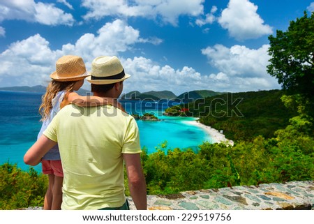 Family of father and daughter enjoying aerial view of picturesque Trunk bay on St John island, US Virgin Islands considered by many as most beautiful beach in Caribbean