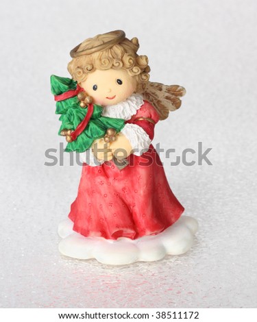 Christmas angel figurine on a icy looking background