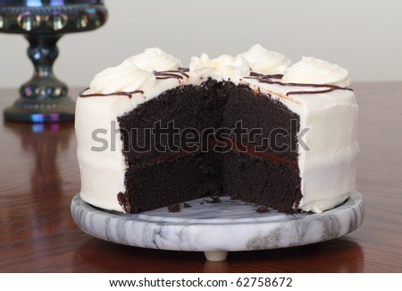 Chocolate cake with white icing on a platter