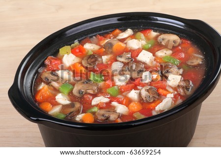 Chicken soup with with mushrooms, peppers, onions and carrots