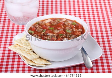 Bowl of chili with beans in a white bowl