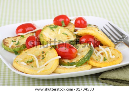 Saute yellow squash and zucchini with grape tomatoes