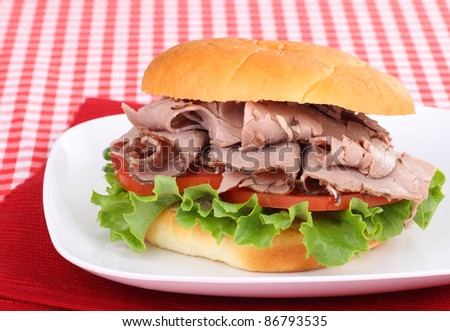 Roast beef sandwich on a red place mat