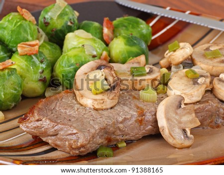 Steak dinner with mushrooms and brussel sprouts