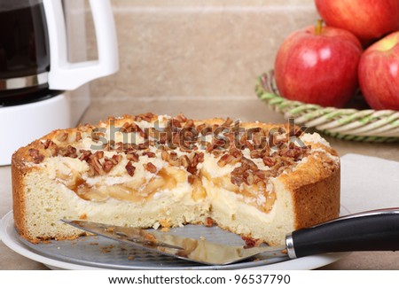 Sliced apple nut coffee cake on a platter