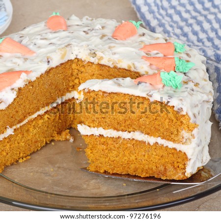 Serving a slice of carrot layer cake