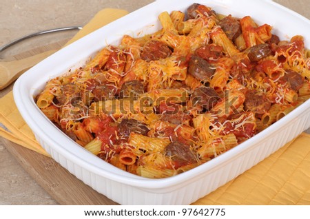 Casserole with rigatoni pasta and sausage on a baking dish