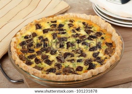 Whole baked mushroom quiche with green onions