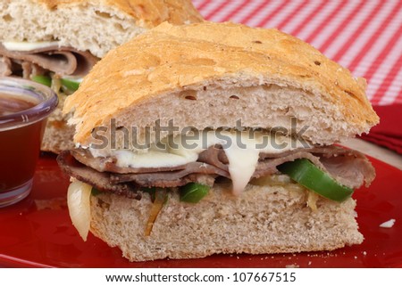 Sliced roast beef sandwich with melted cheese
