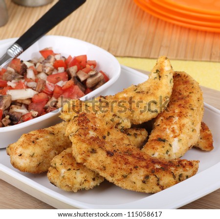 Meal of chicken tenderloin strips on a serving platter